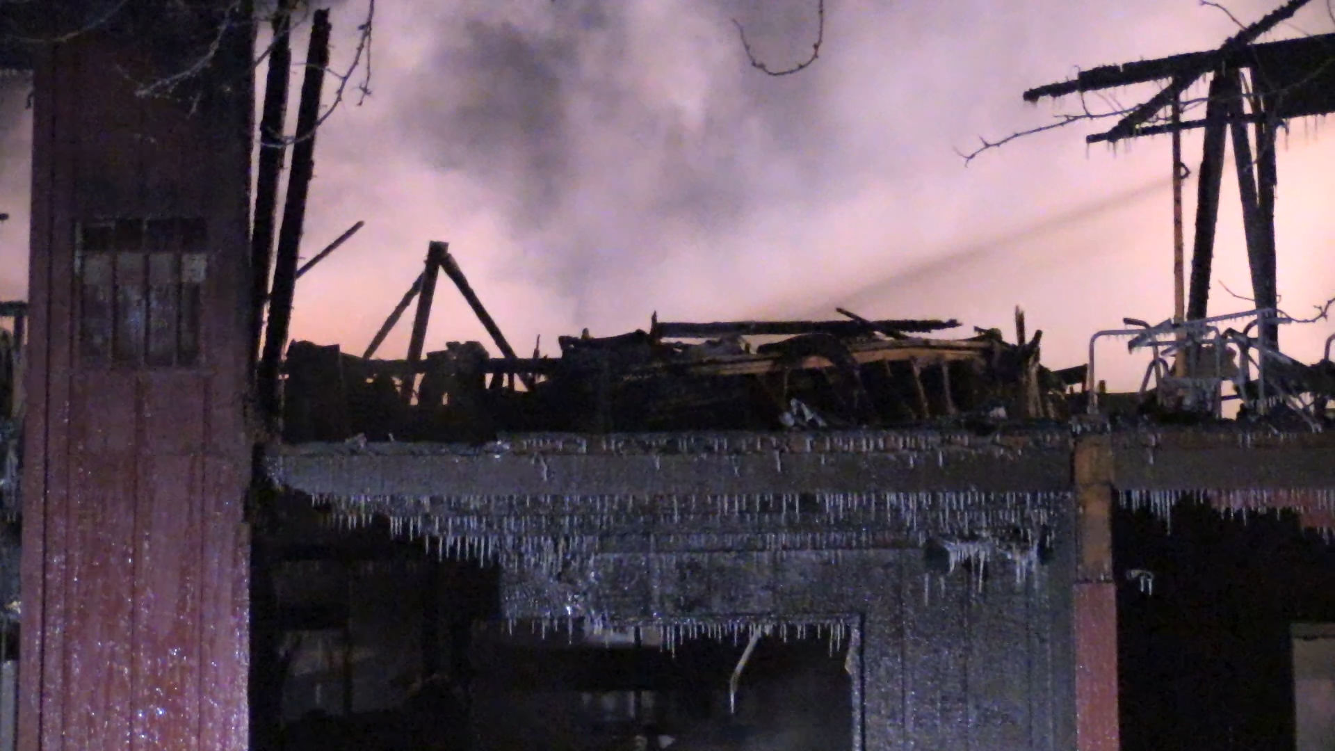 Firefighters continue to battle apartment building fire